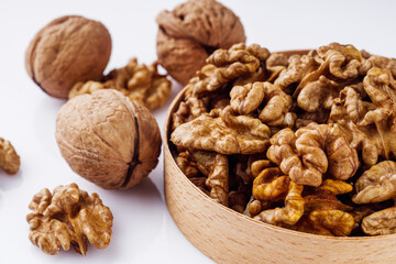 dried walnuts on a white acrylic background