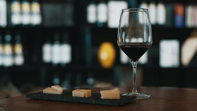 Glass of red wine and cheese.