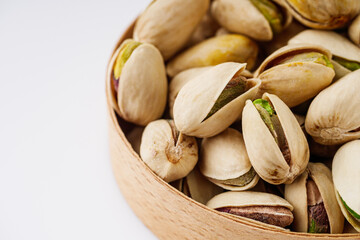 fresh salted pistachios on a white background