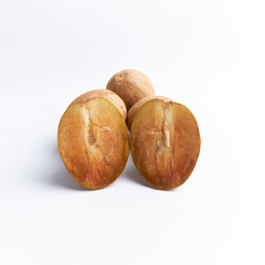 Sapodilla and fresh fruit isolated on a white background