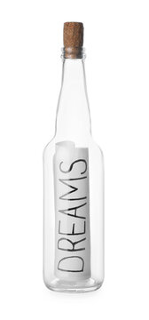 Corked glass bottle with Dreams note on white background