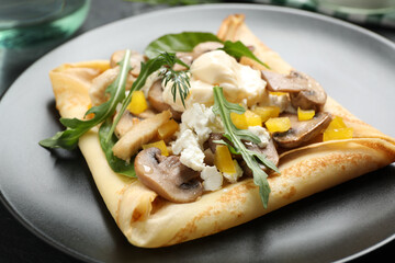 Delicious breakfast with thin pancakes on plate, closeup