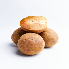 Sapodilla and fresh fruit isolated on a white background