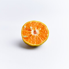 Close-up of freshly cut orange fruit isolated on white background