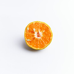 Close-up of freshly cut orange fruit isolated on white background