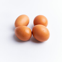 Fresh chicken eggs isolated on a white background