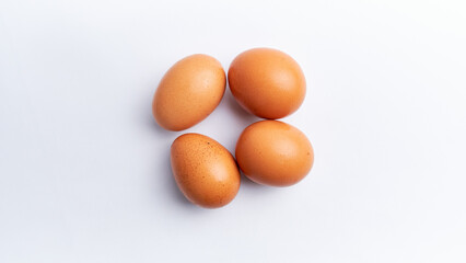 Fresh chicken eggs isolated on a white background