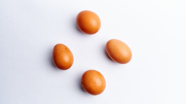 Fresh chicken eggs isolated on a white background