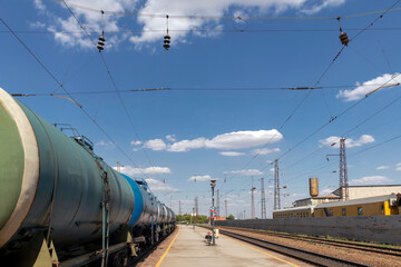 Fototapeta na wymiar Freight train with oil tanks. Selective focus.