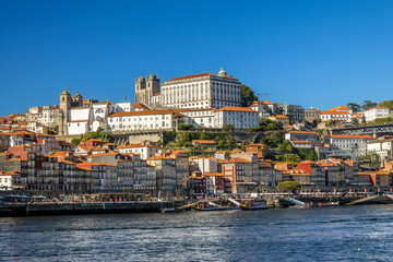 City of Oporto, Portugal in the margins of the Douro river. Douro river in the city of Oporto with...