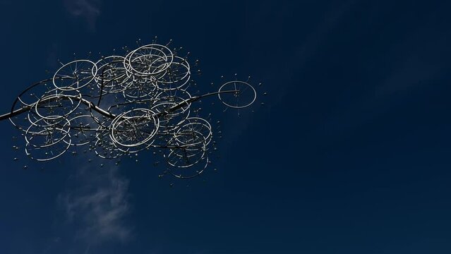 The video can be used as a background For text for something else because it scrolls very nicely and shines against the sky in the sun Circles like wheels or clocks They shine silver High quality 4k