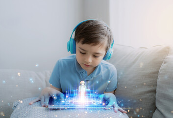 Kid building robot game on tablet with notification face icon pop up,Boy programming Robot on...