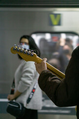 Man playing guitar in a subway station in Buenos Aires, Argentina