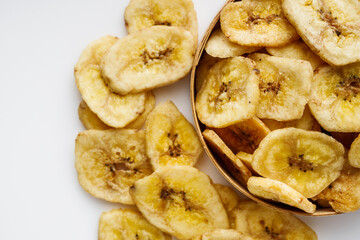delicious dried banana on a white acrylic background