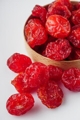dried dogwood berry on a white acrylic background