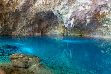 blue water in a cave - los tres Ojos