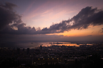 Haifa port view on a sunrise background