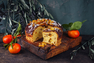 Traditional Italian Panettone Cioccolate cake stuffed with glanced fruits and raisins and chocolate...