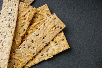 diet crispy bread on a black stone background