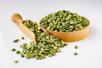 dried green peas on a white acrylic background