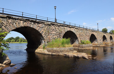 Fototapeta na wymiar Stone arch bridge