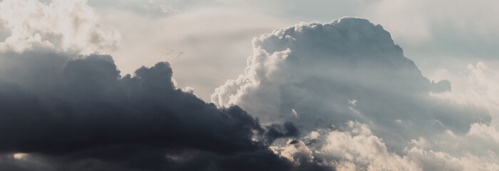 Obraz premium Sky panorama. Beautiful dramatic big clouds in the sky. Landscape of the power of heaven and nature. Copy space