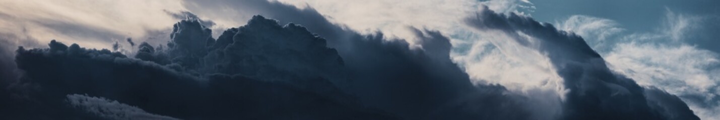 Sky panorama. Beautiful dramatic big clouds in the sky. Landscape of the power of heaven and nature. Copy space