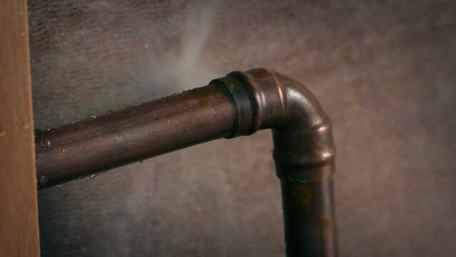 Old Pipe Breaks Sprays Water Closeup