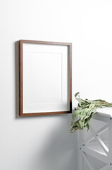 Blank portrait frame mockup on white wall in white room interior