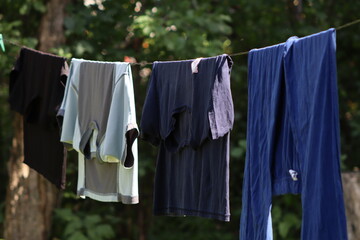 wet clothes are drying outside