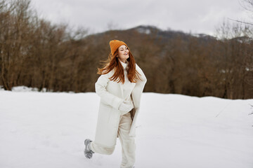 cheerful woman snowy weather walk fresh air There is a lot of snow around