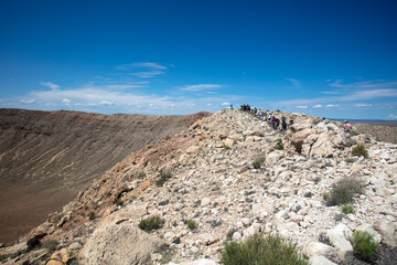 Visitors Exploring The Barringer Meteor Crater where a Meteor Blasted a Giant Hole in the Desert