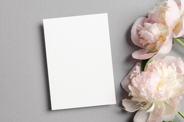 Fototapeta na wymiar Blank invitation or greeting card mockup with fresh peony flowers
