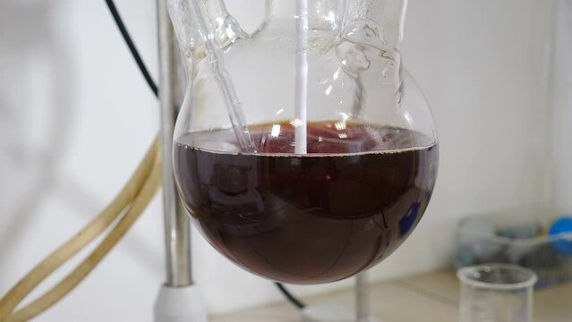 Chemical factory with laboratory. Formalin production testing. liquids being mixed in transparent bowl. Manufacture drugs for medical supplies of pharmacy industry. Pharmacology specialist at work. 4