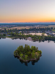 Fototapeta premium Aerial View on a little island in the quarry lake Binsfeldsee at Speyer in Germany.