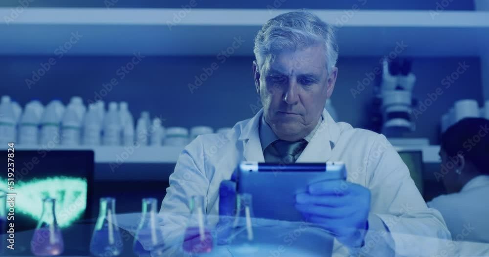 Poster Mature lab scientist testing chemical reactions with a beaker and recording the data on a tablet in an ultraviolet lit lab. Doctor wearing protective gloves while experimenting in a research facility