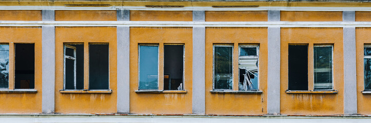 neglected, old windows in a dilapidated building 