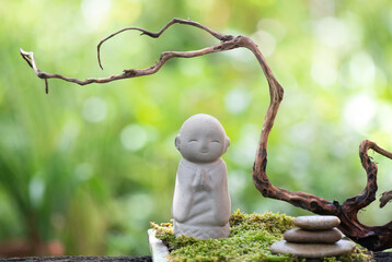 Old buddha statue on nature background.