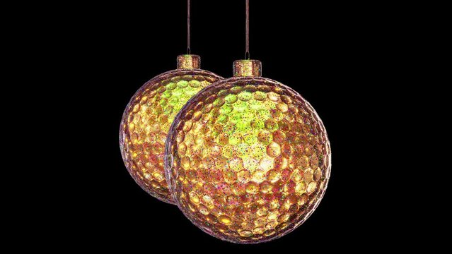 Realistic looping 3D animation of two hanging spinning golden metallic Christmas golf balls covered with colorful glitter rendered in UHD with alpha matte