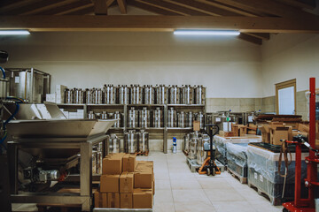 Olive oil plant. Olive farm with a factory. Machines for the production of olive oil and packaging.