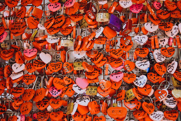 Many red locks in the form of hearts with the names of lovers. Near Juliet's house in Verona. Love,...