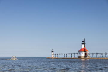 Boat in the channel and St. Joseph North Pier Inner Lighthouse and St. Joseph North Pierhead Outer...