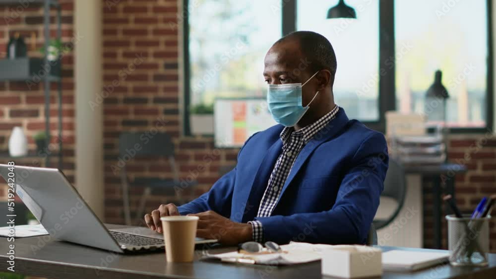 Poster office consultant planning financial statistics on laptop during coronavirus pandemic. executive ass