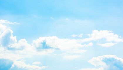 A vast light blue sky with freedom shape of fluffy clouds floating over the air. Soft and pure...