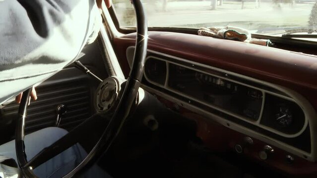 A Man Driving an Old Pickup Truck. Close-Up. 4K Resolution.