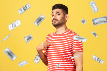 This is rich man. Portrait of arrogant self-confident man pointing at chest, looking proud and...