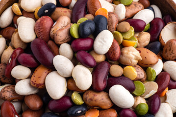 many dried multi-colored beans closeup, an assortment of various kidney beans and peas