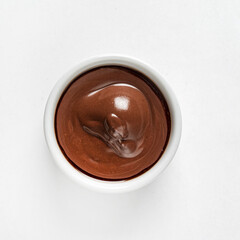 Chocolate mousse in dessert bowl on white background
