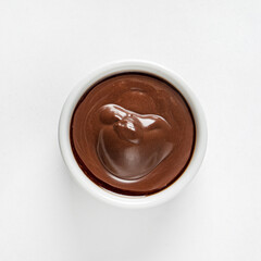 Chocolate mousse in dessert bowl on white background