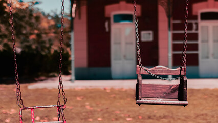 Extreme close-up of an old wooden children's hammock in an old train station in a small town in Buenos Aires